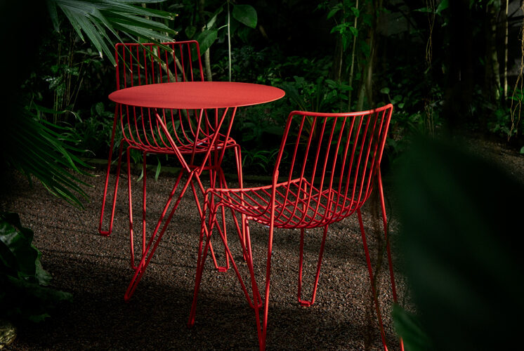 Tio Collection featuring new bold color option on wire chairs and tables designed by Chris Martin for Massproductions