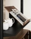 Magazine shelf addition to String Furniture's PIRA G2 system showcasing elegant angled display for periodicals