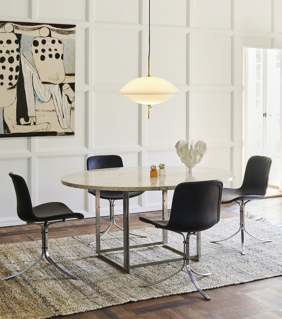 Poul Kjærholm's iconic PK54 dining table by Fritz Hansen now available in standard height with marble top