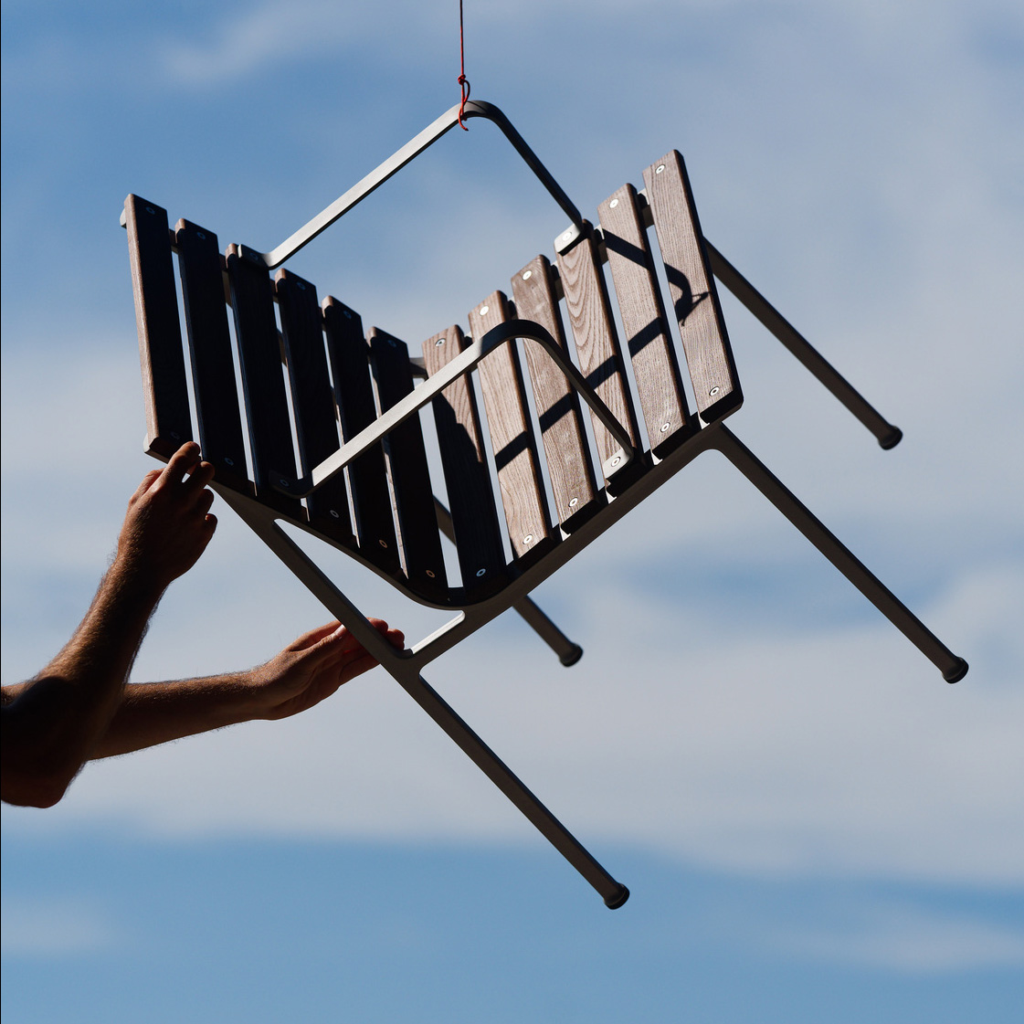 Close-up of Traverse Chair's heat-treated ash slats showing natural patination and weathering process