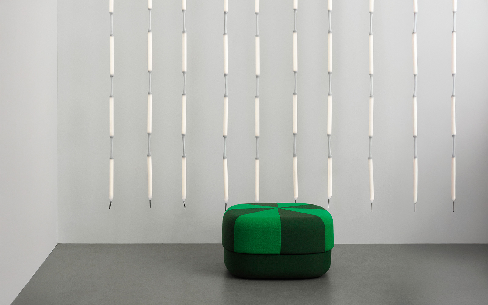 Verena Hennig's Reb Lamp for Normann Copenhagen featuring multiple illuminated modules in mesh fabric arranged as pendant lighting.