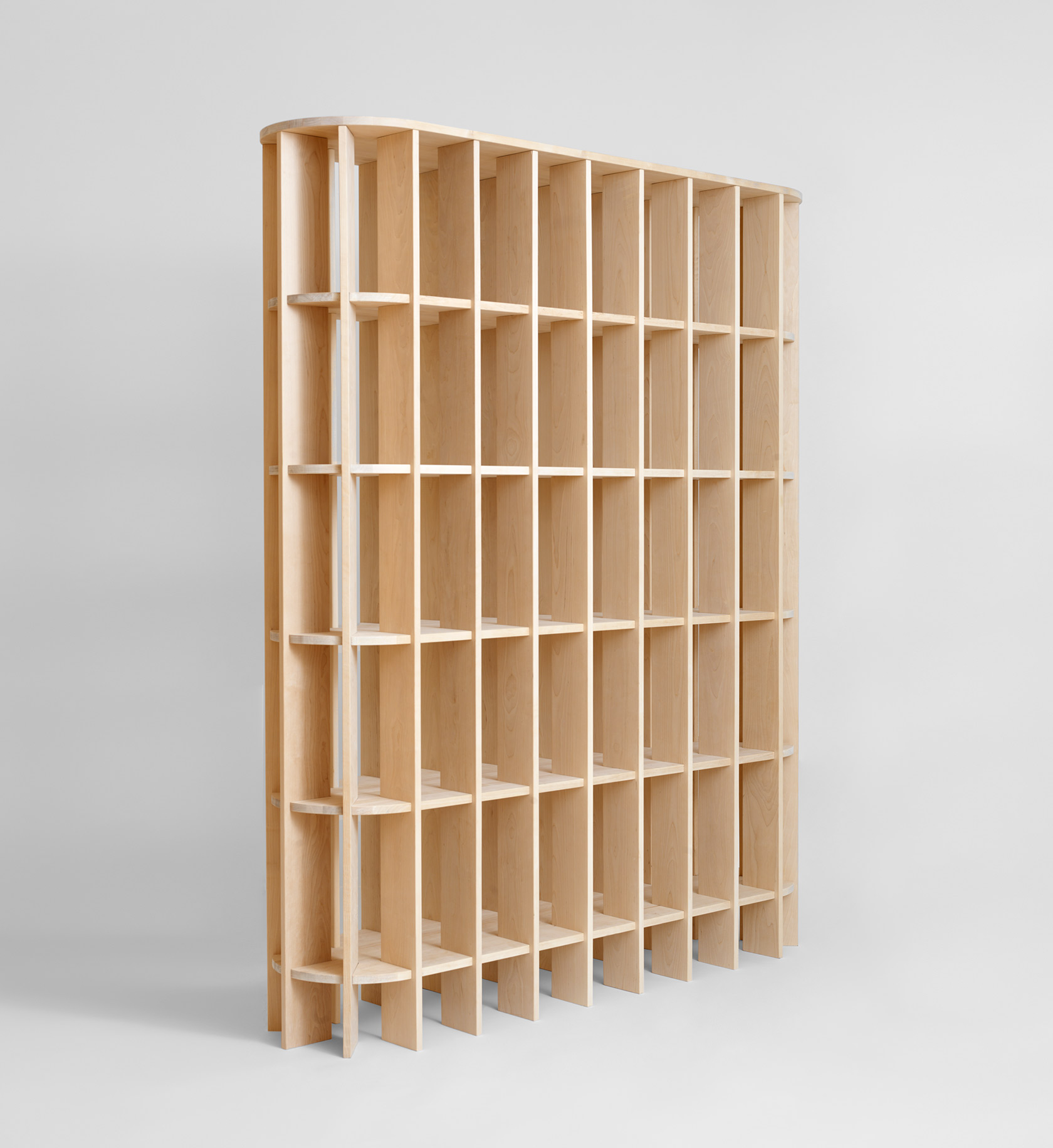 Room divider functionality of V.NA.01 shelf system separating living spaces with elegant design