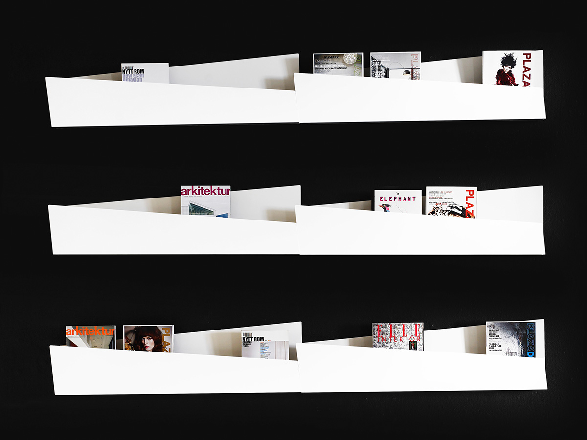 Collar storage units arranged together demonstrating enhanced asymmetric visual impact on wall