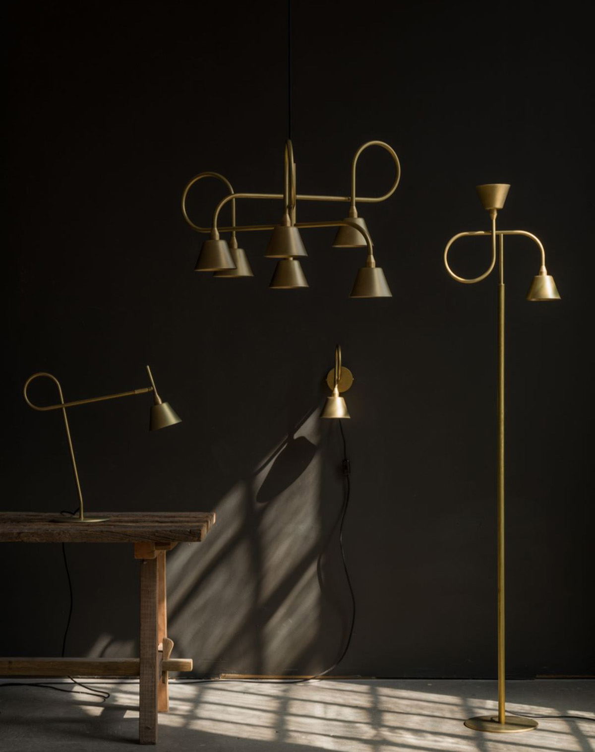 LOOP Family raw brass lighting collection by Jesper Ståhl for Konsthantverk Tyringe shown in modern interior