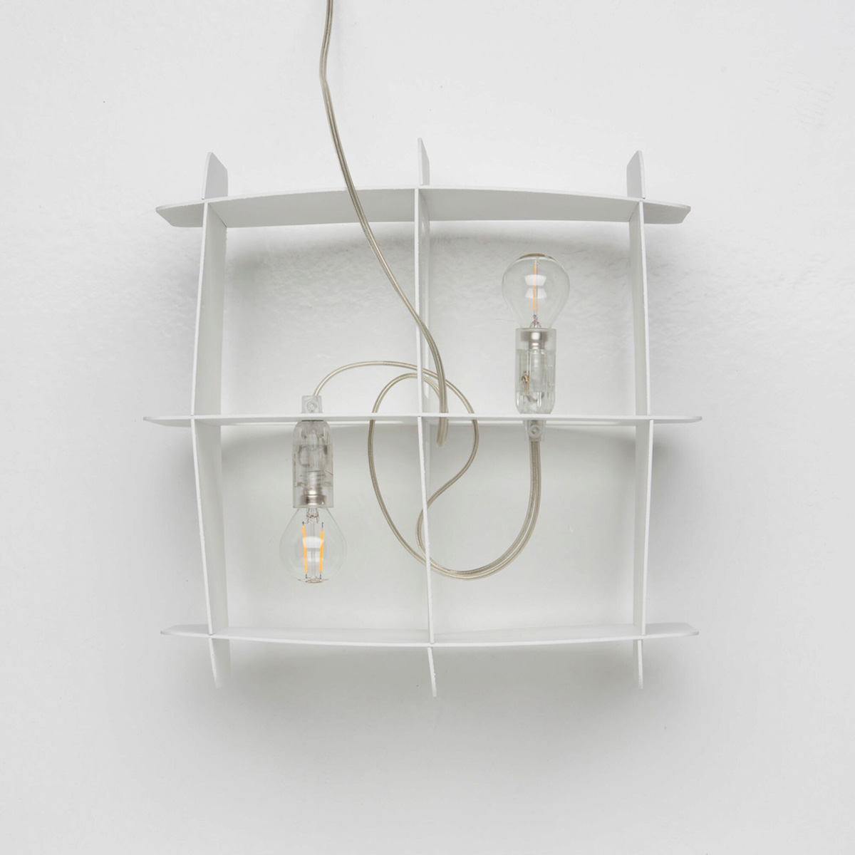 Ristikko pendant lamp isolated showing geometric birch plywood lattice design and warm lighting