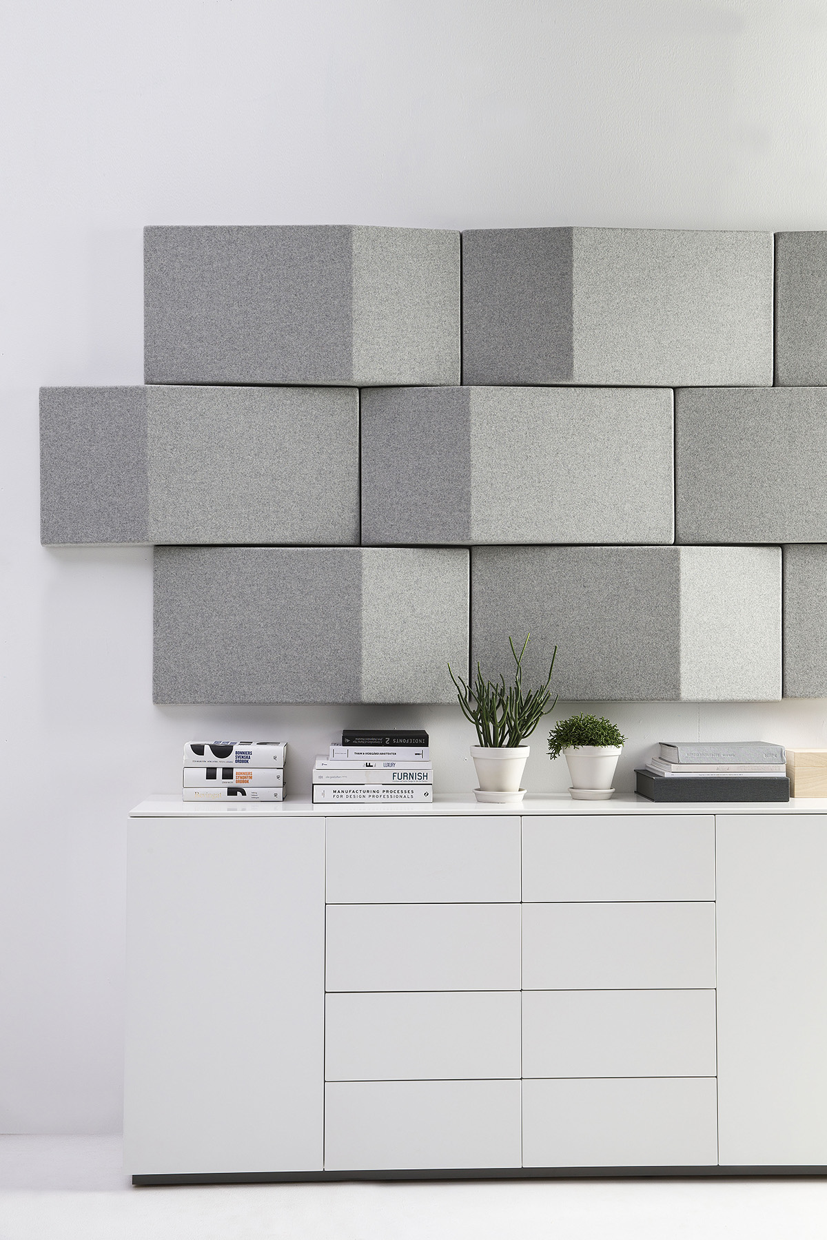 Triline wall panels by Anya Sebton for Abstracta showing triangular acoustic design in modern office setting