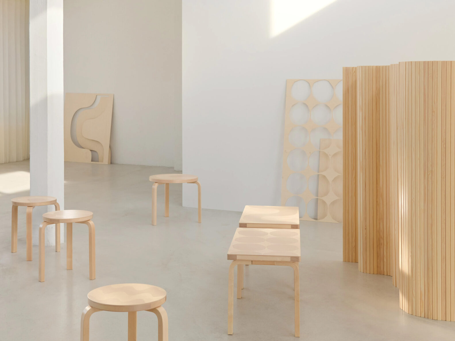 Discover six iconic Artek + Marimekko pieces blending Aalto's furniture design with Isola's legendary patterns in sustainable Finnish birch.