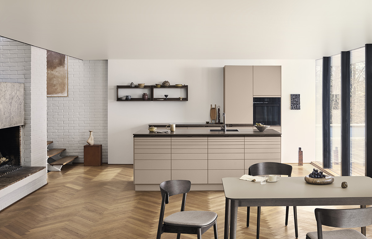 Kvik Align kitchen range by Rikke Frost displaying modular units in clay tone with oak accents