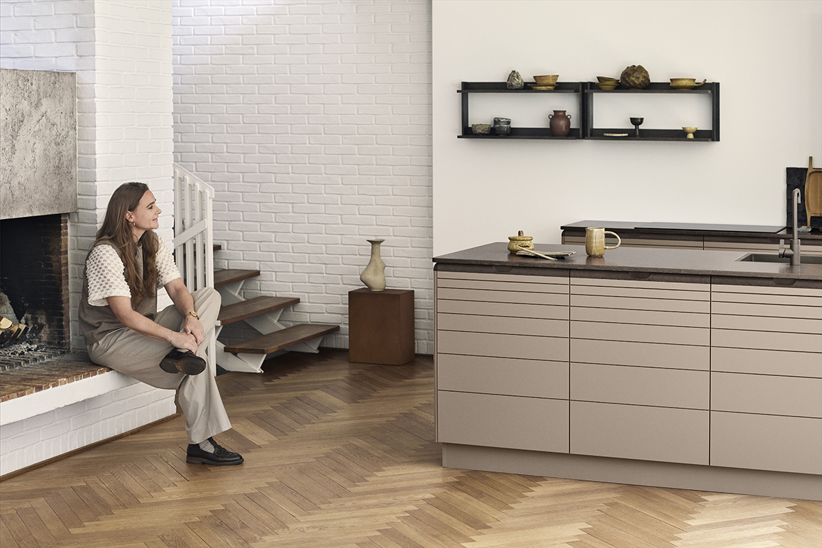 Align kitchen cabinetry with matte recycled PET surface and FSC certified oak handle integration