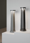 Triad luminaire close-up showing triangular construction and semi-transparent element.