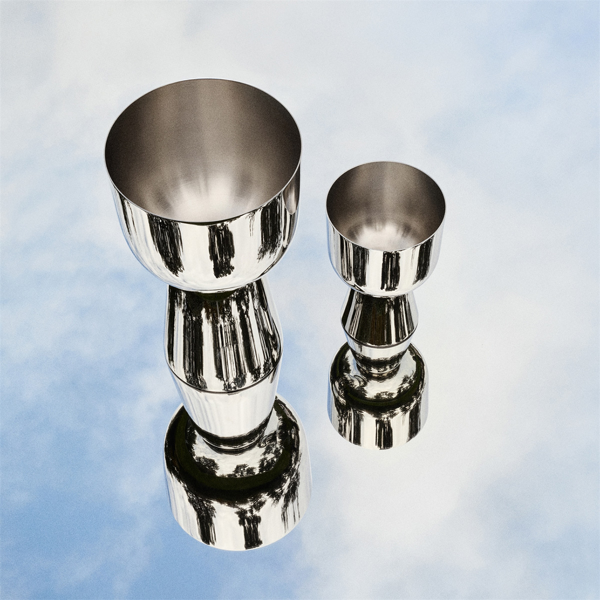 Nappula plant pots XS and M in mirror-polished stainless steel by Matti Klenell for Iittala