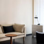Upholstered components balance comfort with visual clarity. Refined seating depth and armrest height support extended use without excess padding.