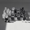 Orrefors and Jay3lle glass chess board, black and clear squares on thick glass base with oak feet