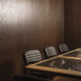 Fogia lifestyle image Flora Armchairs in Elmosoft 99999 leather and polished stainless steel at Maaemo Oslo 04