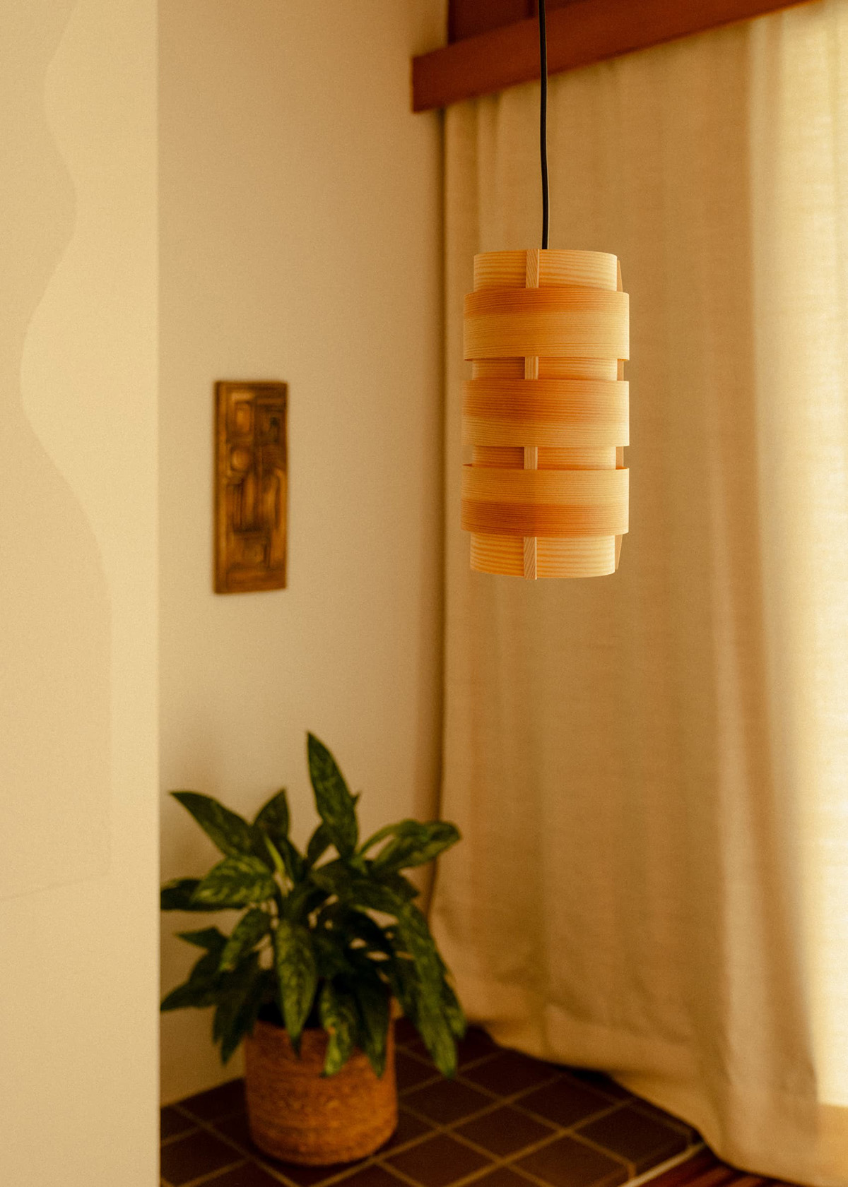 Single 1006 Hans Pendant 14 by Vaarnii hanging in a small interior space