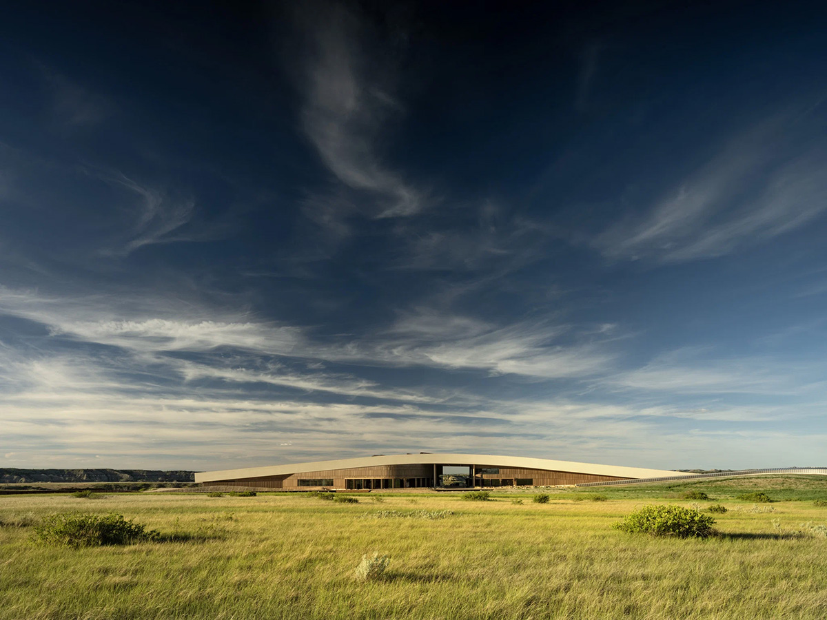Aerial view of Snøhetta’s Theodore Roosevelt Presidential Library on a bluff edge in the North Dakota Badlands